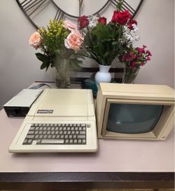 Vintage Apple IIe Computer With Monitor And Floppy Drive