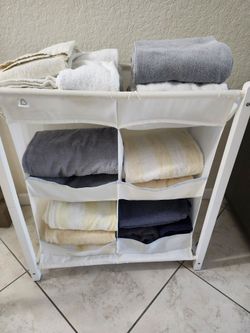 12-Beach/Bath Towels, 15 -Wash Cloths, 5-Hand Towels 1-Bath Mat & Storage Caddy all for $33.-firm