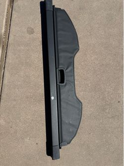 This black retractable cargo cover is designed specifically for 2013–2018 Ford Escape models.
