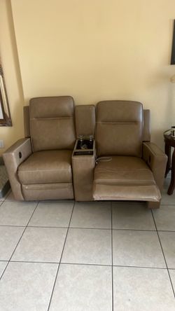 Dual recliner with heated seats and cellphone charger