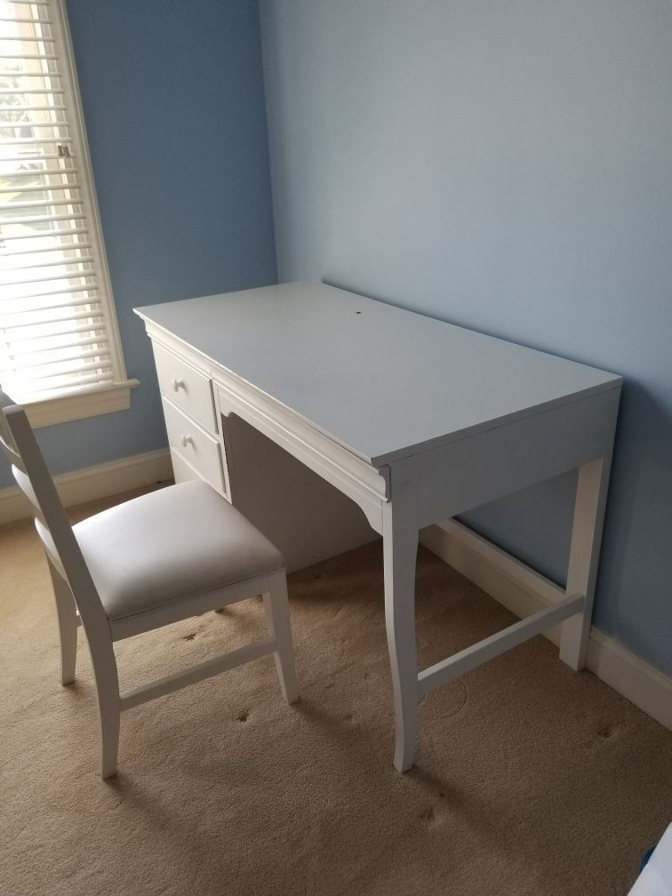 White wooden desk and chair