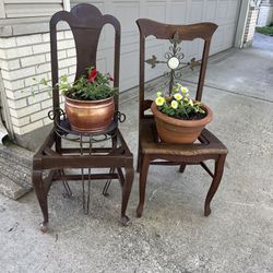 Repurposed Antique vintage oak side chair into a planter w/ clay pot & spreading  petunias 