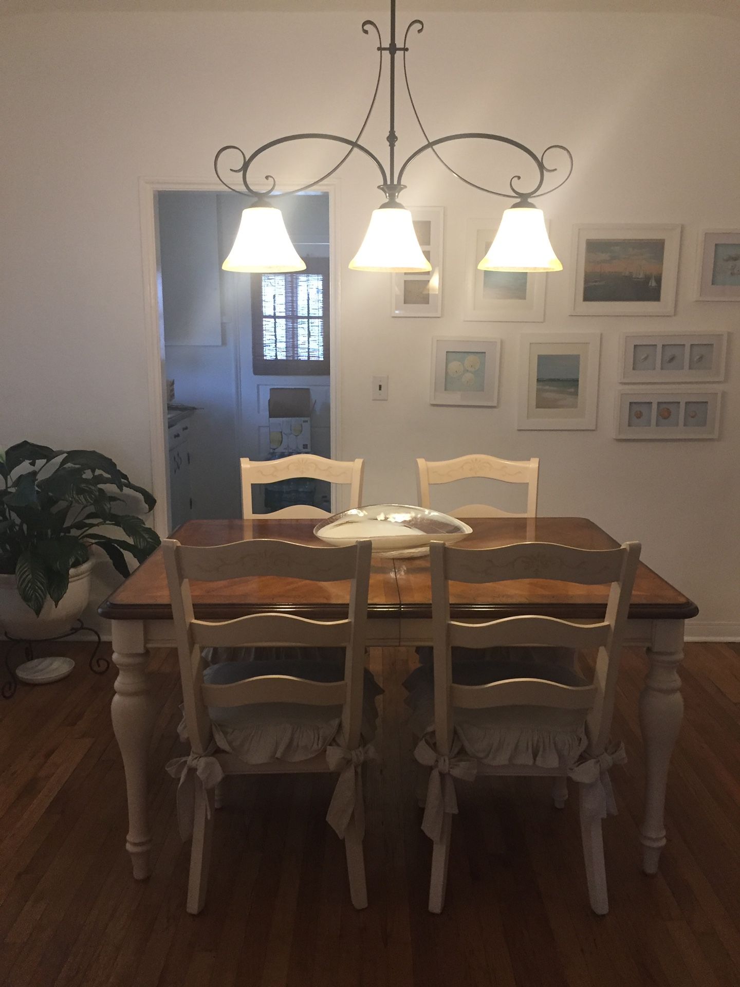 Dinner table with 4 chairs and lamp