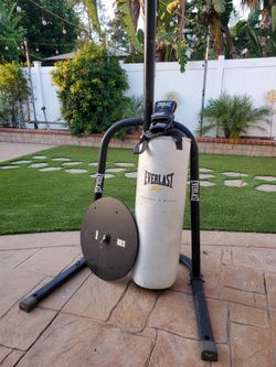 Heavy boxing bag, with gloves &  stand.