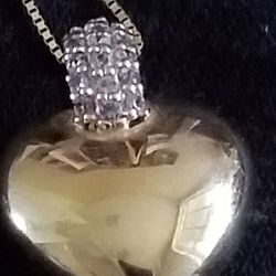 This beautiful 14 Karat Solid Gold Diamond Heart Charm And 14 Karat Gold Chain