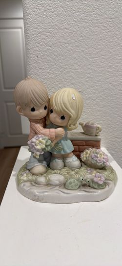 Precious Moments hugging girl and boy