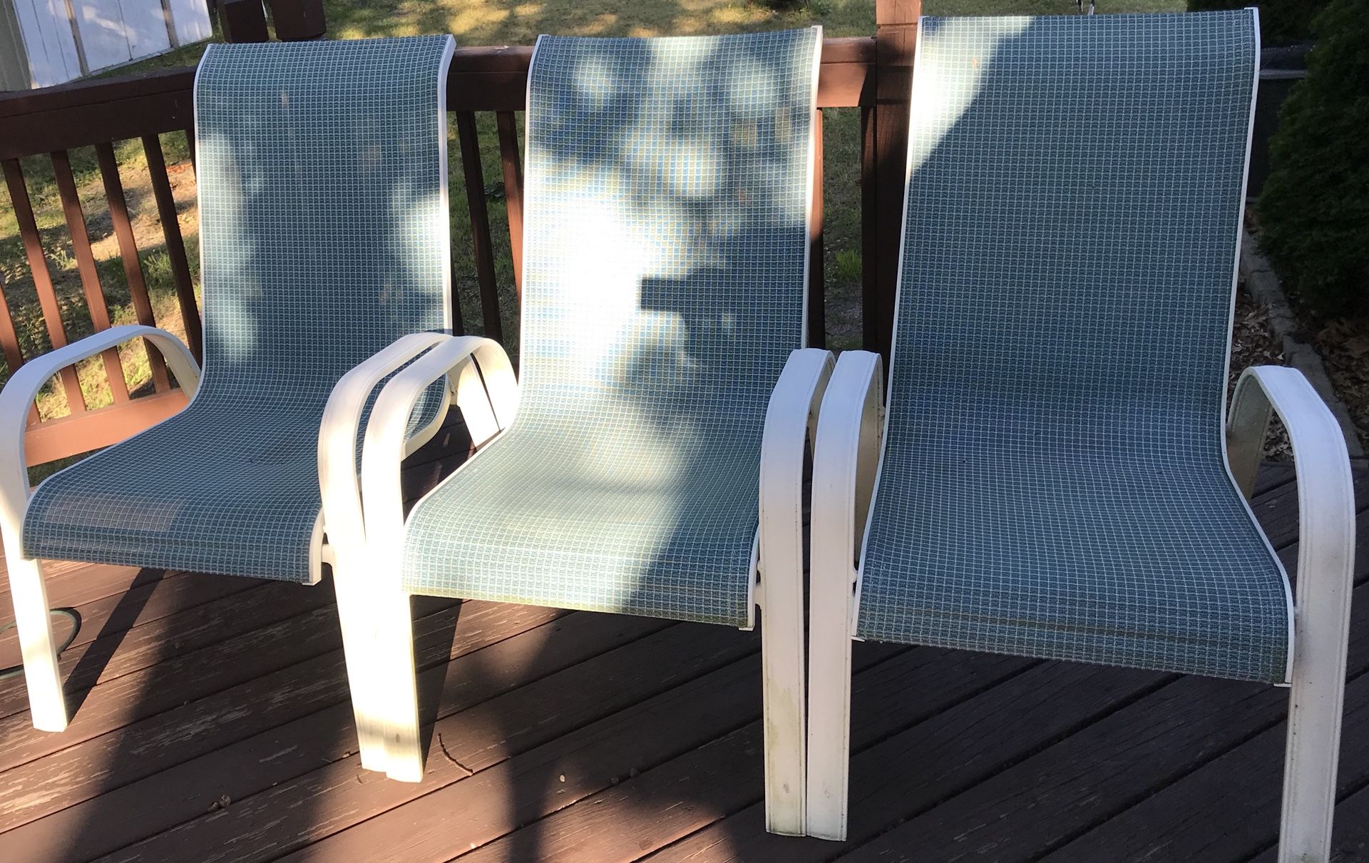 Six aluminum stackable patio chairs