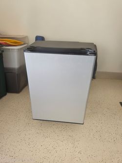 Mini Refrigerator-19" by 26".  For someone  interested  in fixing