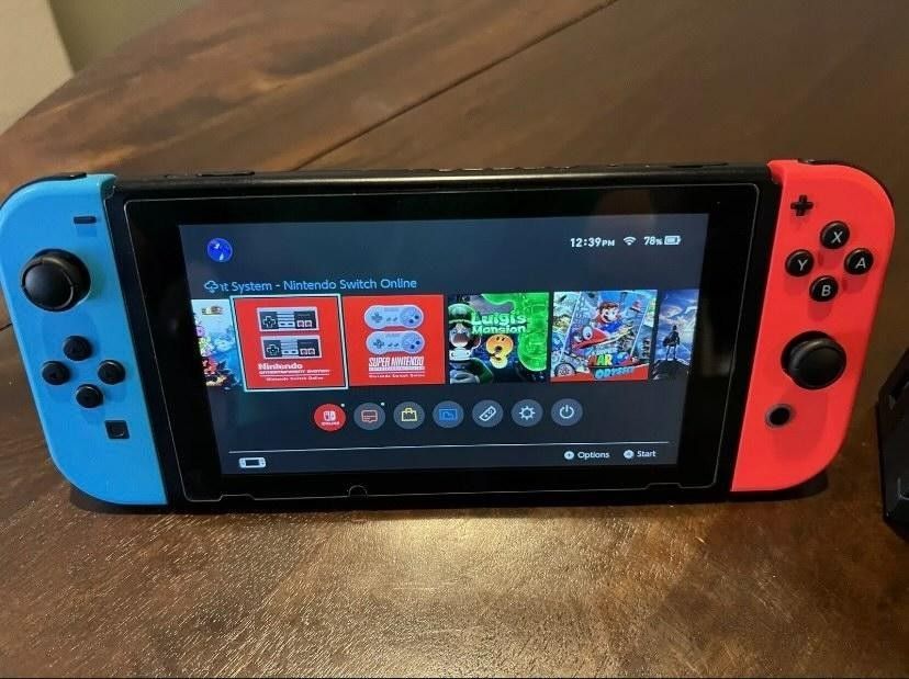 Nintendo Switch Console Black with Neon Blue and Neon Red Joy Controller Used