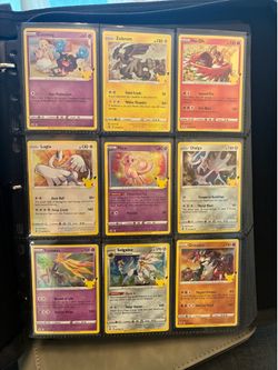 Pokemon binder with a page of cards $10