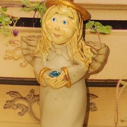 #2180, SIGNED, MID-CENTURY  CARVED ANGEL PENDANT WITH BLUE CRYSTAL. 1"3/4  
