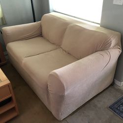 White Loveseat with Two Couch Covers