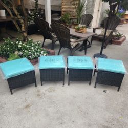 wicker woven Stool/Ottoman with 4 aqua cushions. (Table & plant not included)