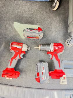 Milwaukee M18 hammerDrill and Impact Driver with Batteries 4amp and 2 amp