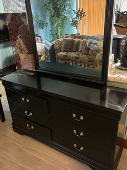 Black dresser with mirror