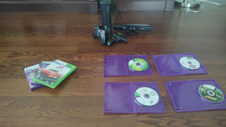 Xbox 360 with games , sensor and two controllers