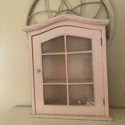 Unique light pink curio cabinet