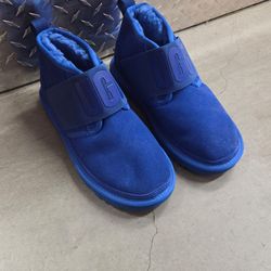 UGG Neumel Snapback boots in bold blue color with strap detail.