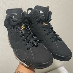 Jordan 6 gold and black kicks