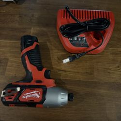 Milwaukee m12 impact drill and battery Brand new