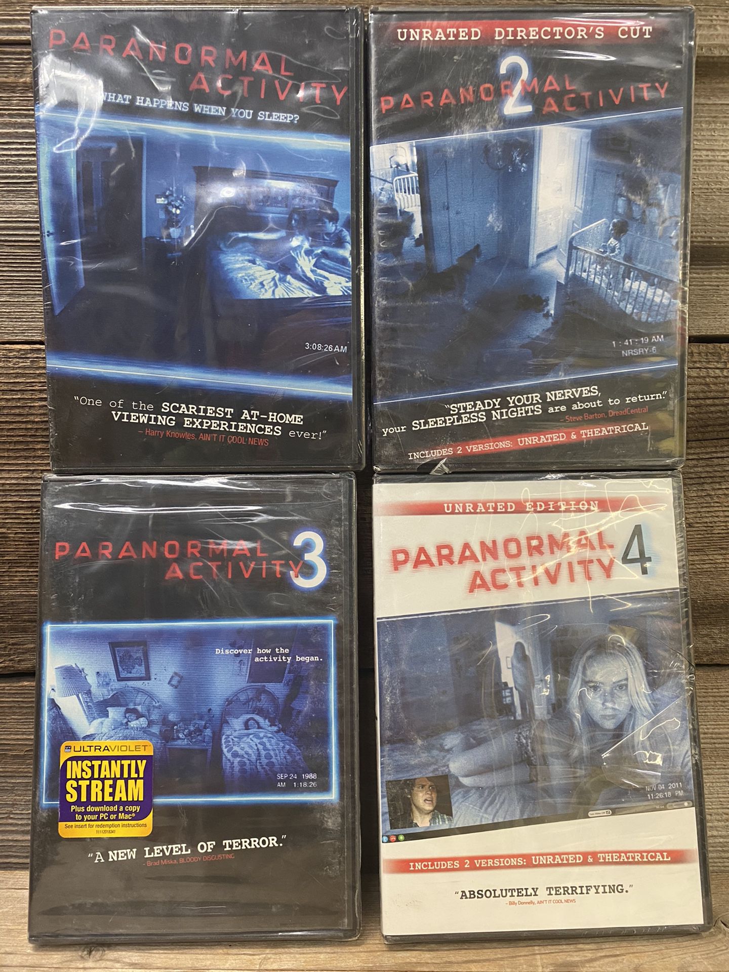 PARANORMAL ACTIVITY DVDs #1-4 - New and sealed