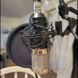 3 Mics with arms that bend and attach to a table, 3 Pop Filters,  Behringer U-Phoria UMC404HD, and Headphones Mixer.  XLR Cables not included.