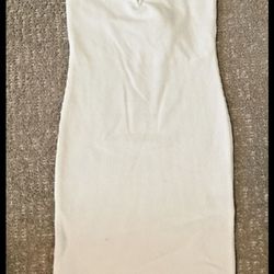 Short, fitted, strapless dress in textured jersey. Sweetheart neckline and lining at top.  Size S
