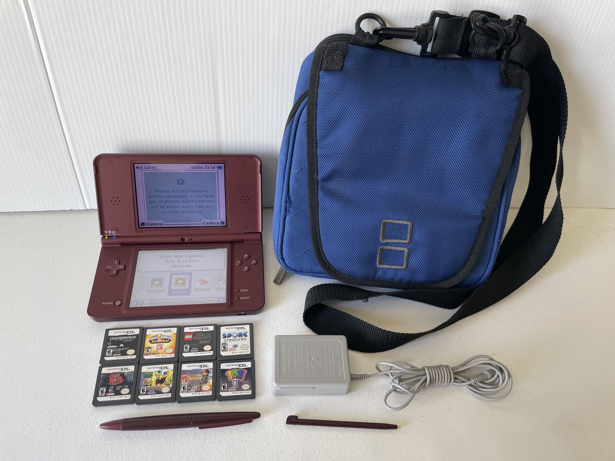 Nintendo DSi XL with 10 Games And Carrying Case