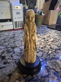 This figure is a vintage Chinese resin statue of Shou Lao