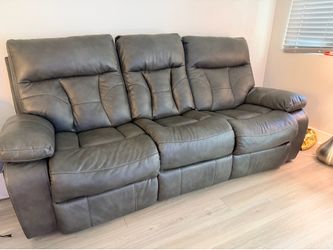 Gray reclining sofa with cupholders