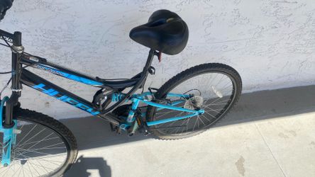Mountain  Bike blue with extra bike seats. Rear and from shocks with adjustable rear spring