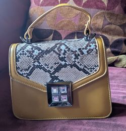 For Sale. Really cool dark yellow leather purse. $25 OBO