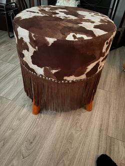 Western footstool, cow, print studs, and fringe