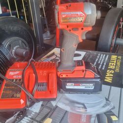Milwaukee Charger And Impact Drill And M18 Red Lithium Battery