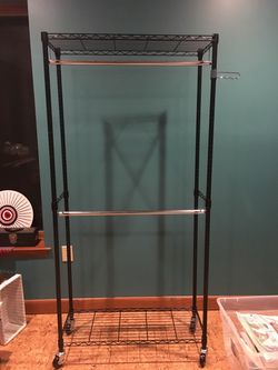 Rolling metal garment rack clothing rack