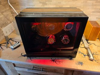 Watch winder case with 6 different nixon watches