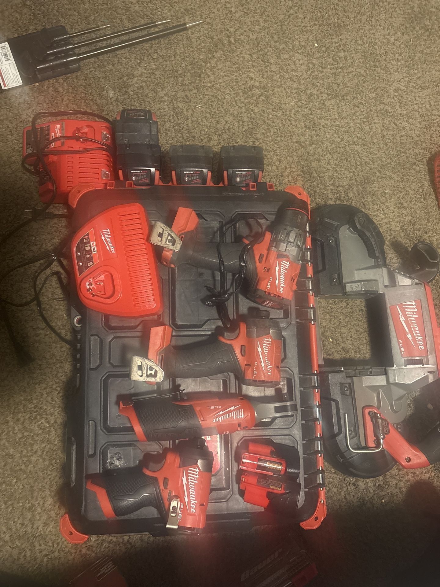 Milwaukee  4 Piece Set 4 18V Batteries 2 M12 Batteries With Chargers