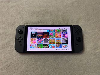 Nintendo Switch OLED model with 7500 Games