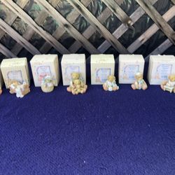 Cherished Teddies in original boxes. 