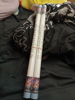 Two K-pop Demon Hunter posters