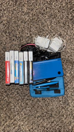 Nintendo DSI XL Blue with chargers, extra stylist, and case with games