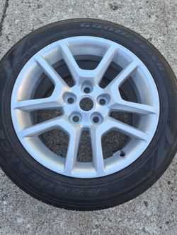 Brand new Chevy rim and tire