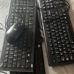 Three Keyboards And A Mouse 