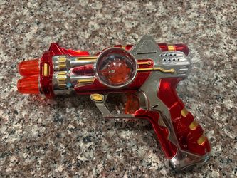 Red and Silver Toy Space Ray Gun. Makes noise and lights up