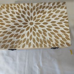 Wooden box with a floral pattern.