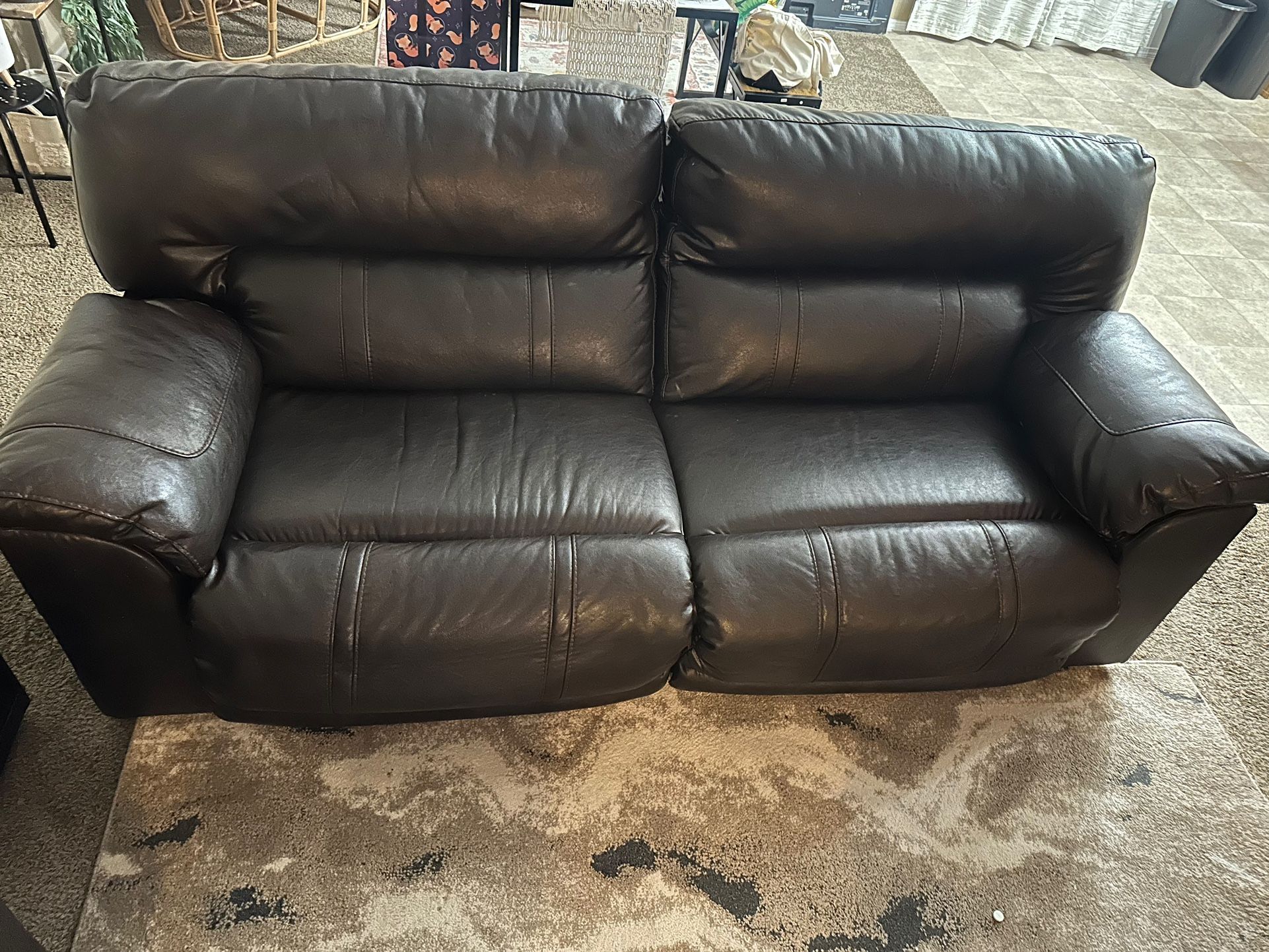 set of 2 brown couches that recline
