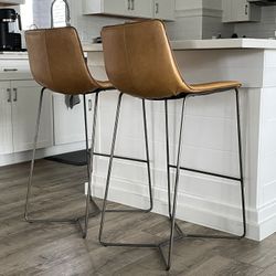 West Elm real genuine saddle vegan leather matching high bar stools (floor to seat: 30”).  In great used condition. Price is for both. 