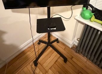 TV stand with shelf and wheels