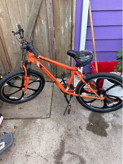 24" boys Mongoose Alert Mag Wheel Bike in orange.