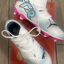 2 pairs of Puma cleats for kids’.